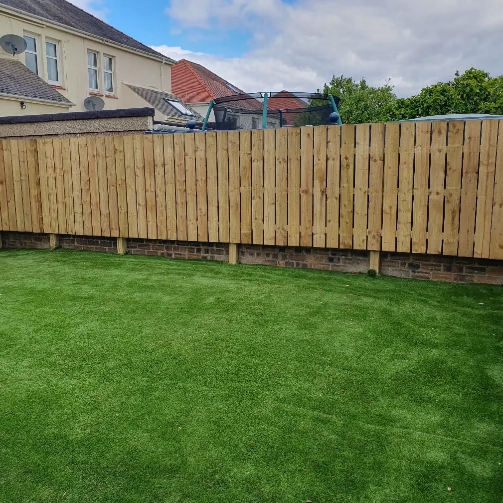 Completed natural timber garden boundary fence