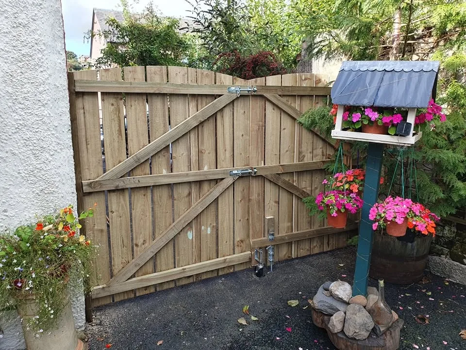 Timber garden gate with ironmongery